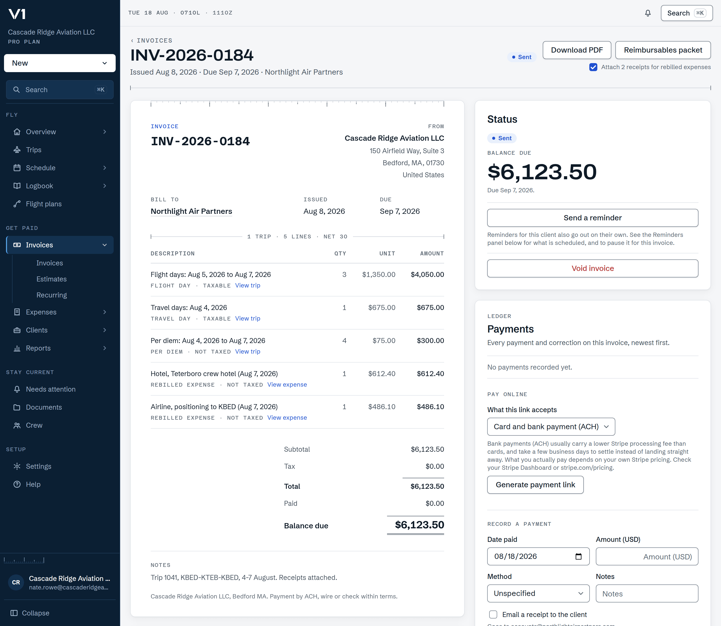 A sent invoice in V1, numbered INV-2026-0184 and due Sep 7, 2026, drawn as the document the client receives. Its five lines came off one trip: three flight days at $1,350.00, a travel day, four days of per diem, and two rebilled receipts, with a double-ruled balance due of $6,123.50. Alongside, the status card with a reminder and void, and a payments panel offering a card-or-bank payment link. Illustrative data.